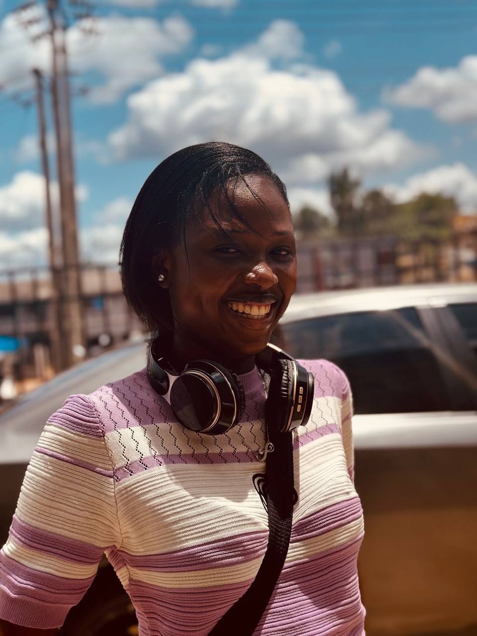 Portrait of Mary Famuagun, senior software engineer, smiling outdoors